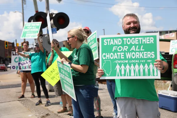 Choate workers stand together at a picket