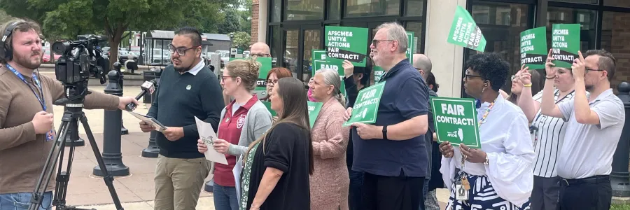 Champaign County employees announce the results of their strike vote in May 2025.